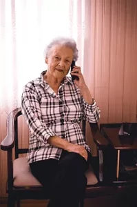 Senior on the phone calling for help from Care Matters Always LLC